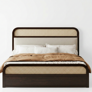 Bed with wicker headboard and footboard on a white background