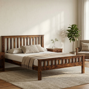 Wooden bed in a bedroom with a plant and sofa