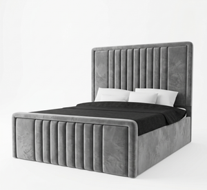 Gray upholstered bed with black bedding on a white background