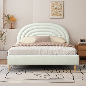 Light green bed with a unique headboard design in a bedroom setting.