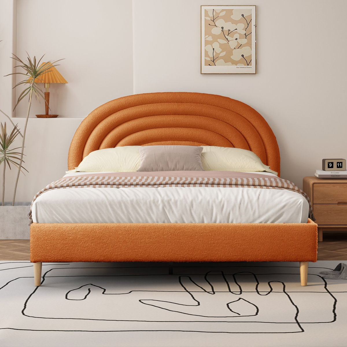 Orange upholstered bed in a bedroom setting with decor elements.