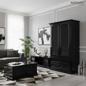 Modern living room with black wardrobe, coffee table, and decor items.